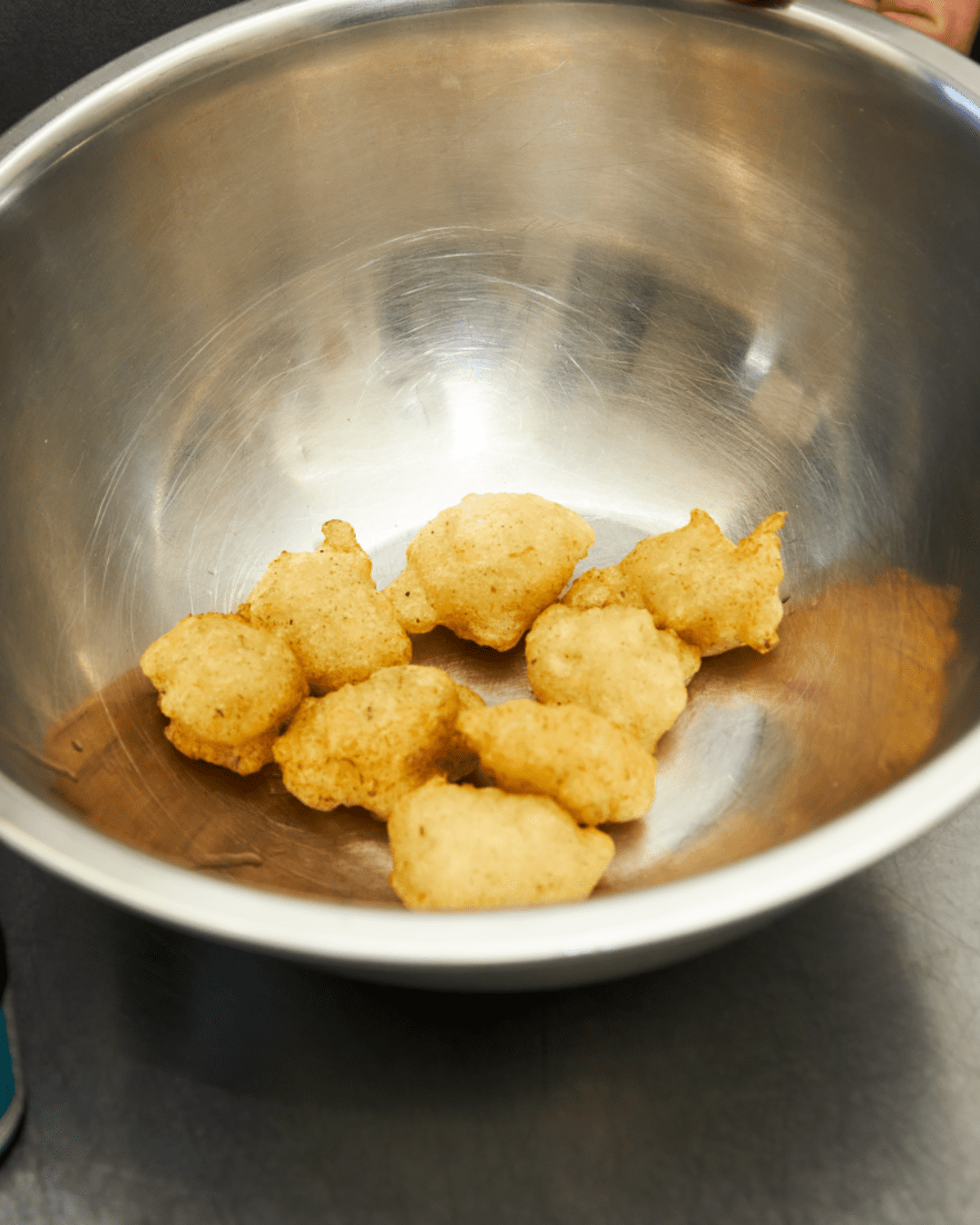 Fritelle di baccala in a tin bowl