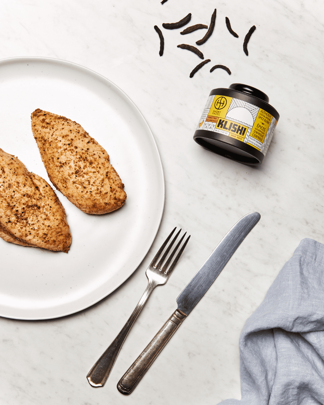 Grilled Klishii chicken breast with klishi mild spice beside it